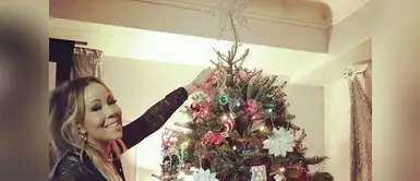 La cantante Mariah Carey posa muy feliz colocando la estrella en su arbolito. La cantante Mariah Carey posa muy feliz colocando la estrella en su arbolito.