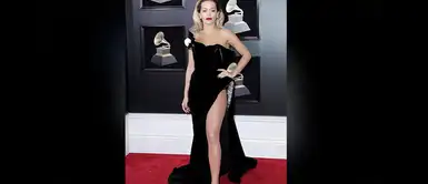 Rita Ora, muy sexy con un vestido negro con lentejuelas y escote palabra de honor de Ralph&Russo con el que ha presumido de piernas. Rita Ora, muy sexy con un vestido negro con lentejuelas y escote palabra de honor de Ralph&Russo con el que ha presumido de piernas.