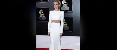 Kristin Cavallari con un diseño blanco minimalista, hombreras marcadas y transparencias en la cintura de Alex Perry. Kristin Cavallari con un diseño blanco minimalista, hombreras marcadas y transparencias en la cintura de Alex Perry.