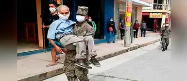 Bono 380 soles: militar lleva en brazos a anciano para que cobre subsidio Bono 380 soles: militar lleva en brazos a anciano para que cobre subsidio