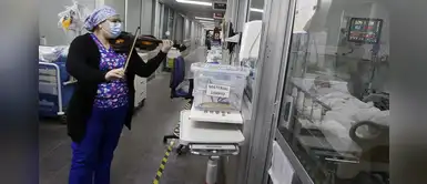 Enfermera toca el violín para consolar a pacientes con COVID-19 | VÍDEO Enfermera toca el violín para consolar a pacientes con COVID-19 | VÍDEO