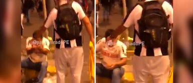 Hincha de Alianza Lima ayuda a uno de Universitario en medio de la marcha Hincha de Alianza Lima ayuda a uno de Universitario en medio de la marcha