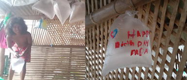 La conmovedora escena se dio en Filipinas. Niños usan bolsas de plásticos como globos para organizarle una fiesta a su papá