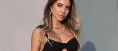 Flavia Laos con top corsé blanco Flavia Laos manifiesta su amor por los corsé en cautivador y pícaro look satinado