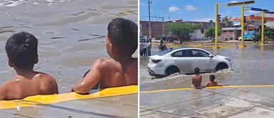 Niños aprovechan lluvias torrenciales en Piura y convierten la calle inundada en su piscina privada Niños aprovechan lluvias torrenciales en Piura y convierten la calle inundada en su piscina privada
