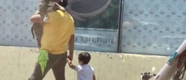 El hombre recibió críticas en las redes sociales. Padre causó polémica al cargar a su perro en lugar de su hijo: "El niño tiene zapatillas"
