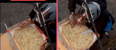 Captan a delivery comiéndose una rebanada de pizza y luego acomodándola en la caja Captan a delivery comiéndose una rebanada de pizza y luego acomodándola en la caja
